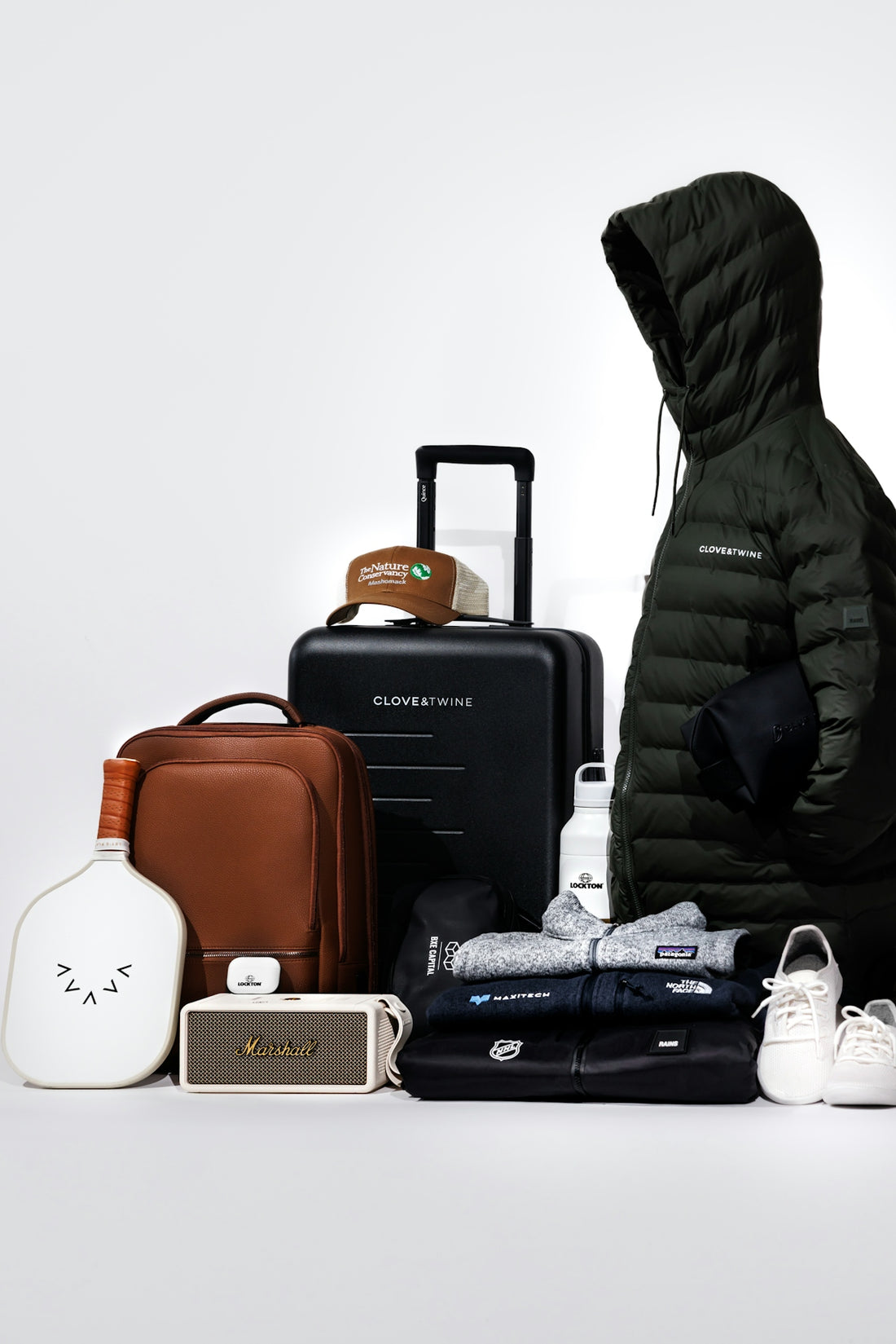 Collection of travel gear and clothing items on-the-go essentials